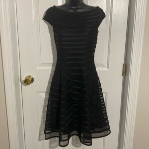 Classic Black Dress. A-line w/flexibility to it. Beautiful and comfortable!
